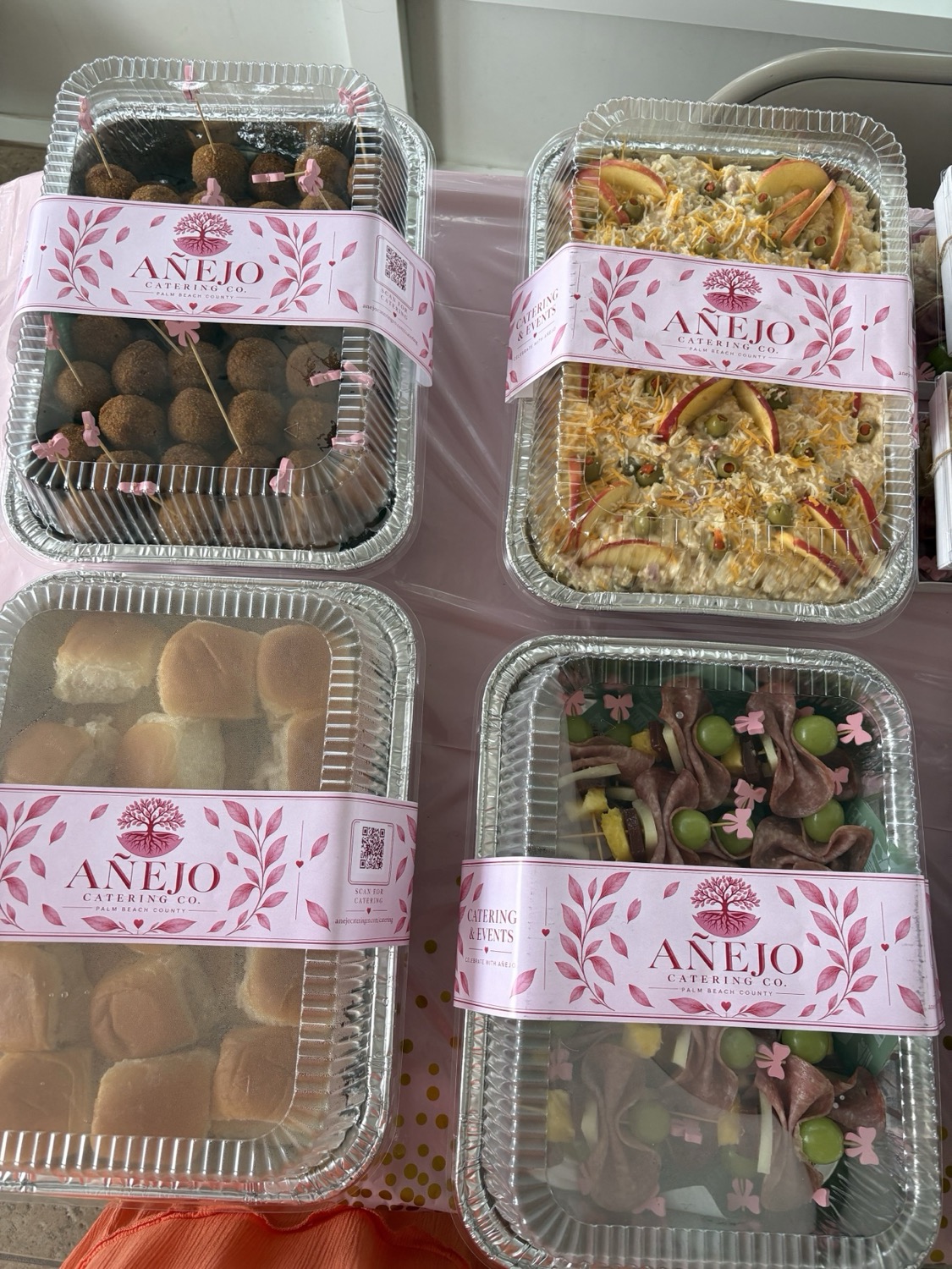 Coordinated Añejo party trays with pink labels