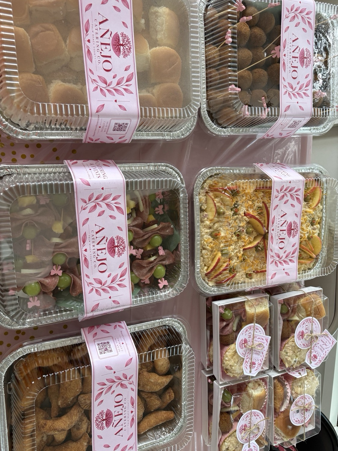 Full spread of party trays and personalized Cajitas