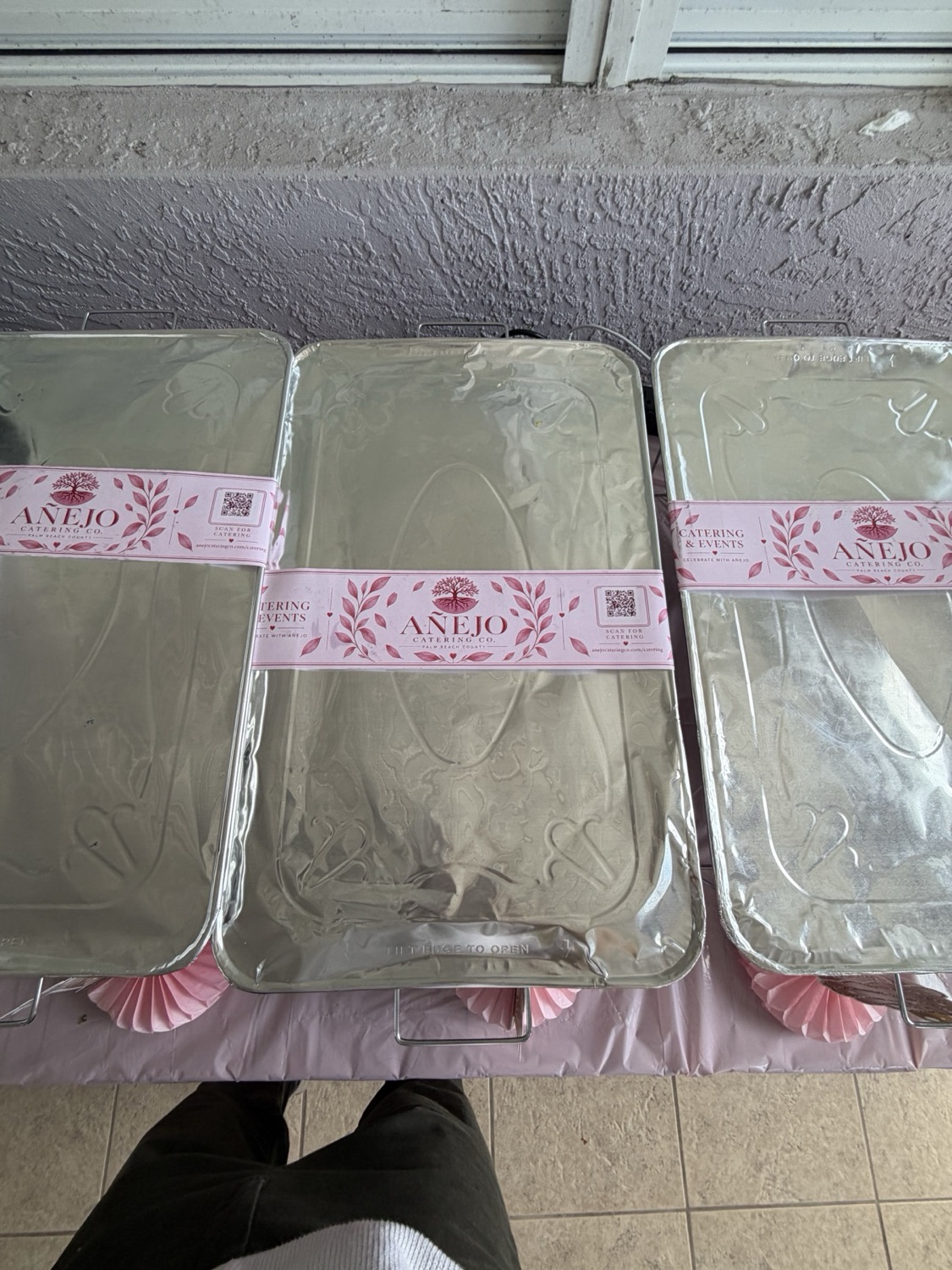 Close view of covered Añejo catering trays